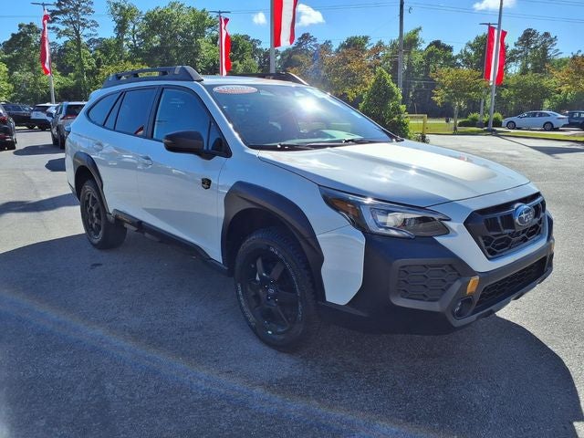 2025 Subaru Outback Wilderness in Crystal White Pearl — front three-quarter view