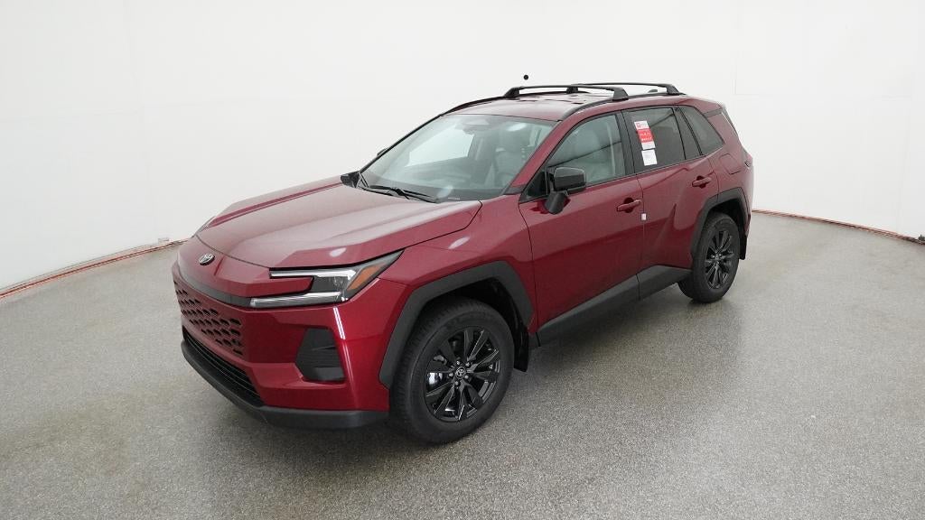 2026 Toyota RAV4 XLE Premium in Ruby Flare Pearl — front three-quarter view